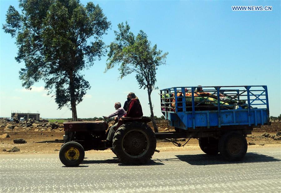 SYRIA-DARAA-CIVILIANS-RETURN-HOME