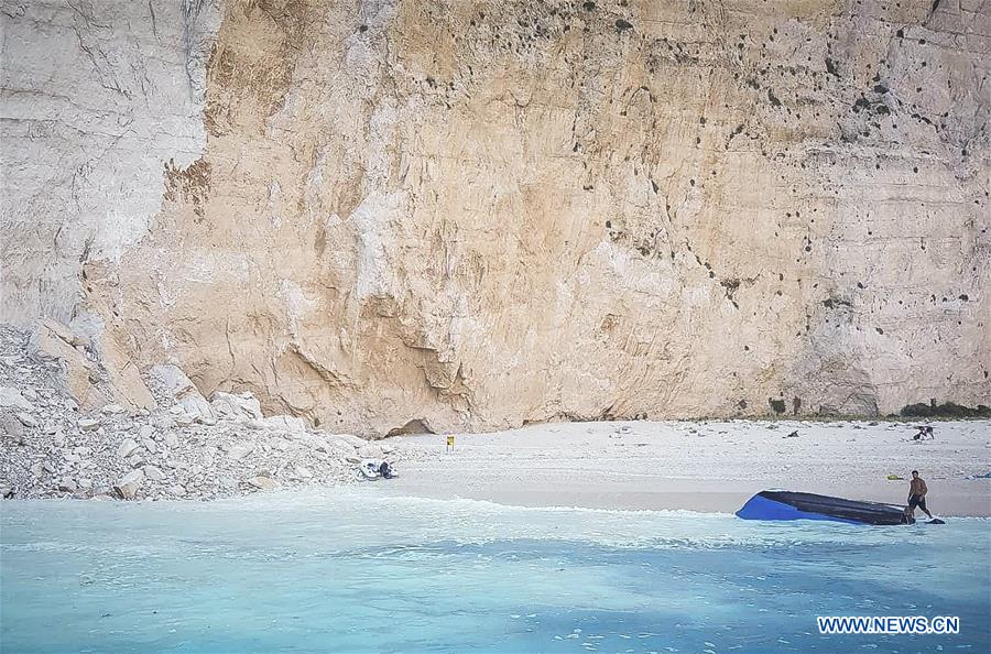 GREECE-ZAKYNTHOS-NAVAGIO BEACH-ROCK SLIDE